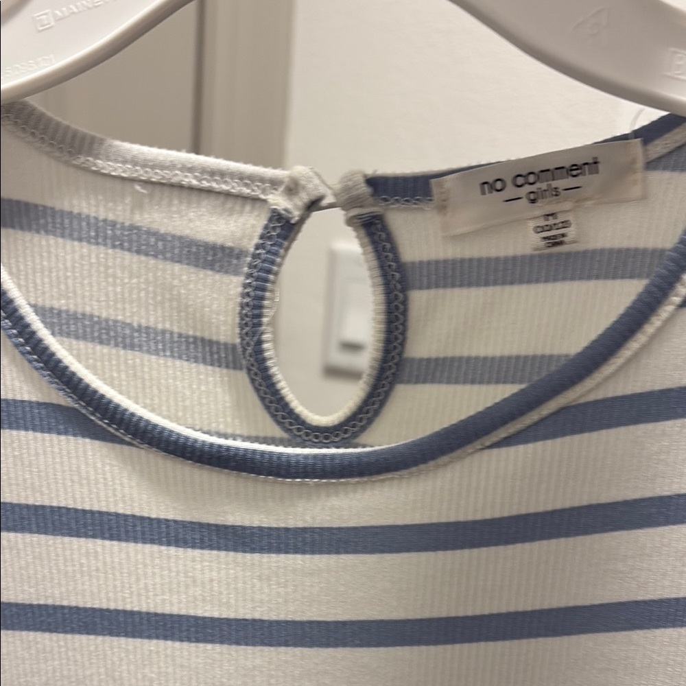 A romper suit. Haven’t been worn before. Small tear around the neck area.